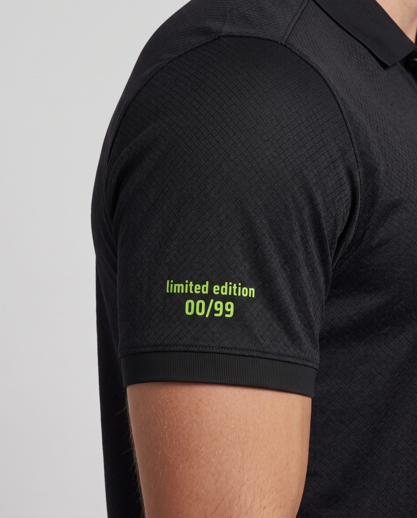 Close-up of the right sleeve of the black S. Abascal 1 shirt