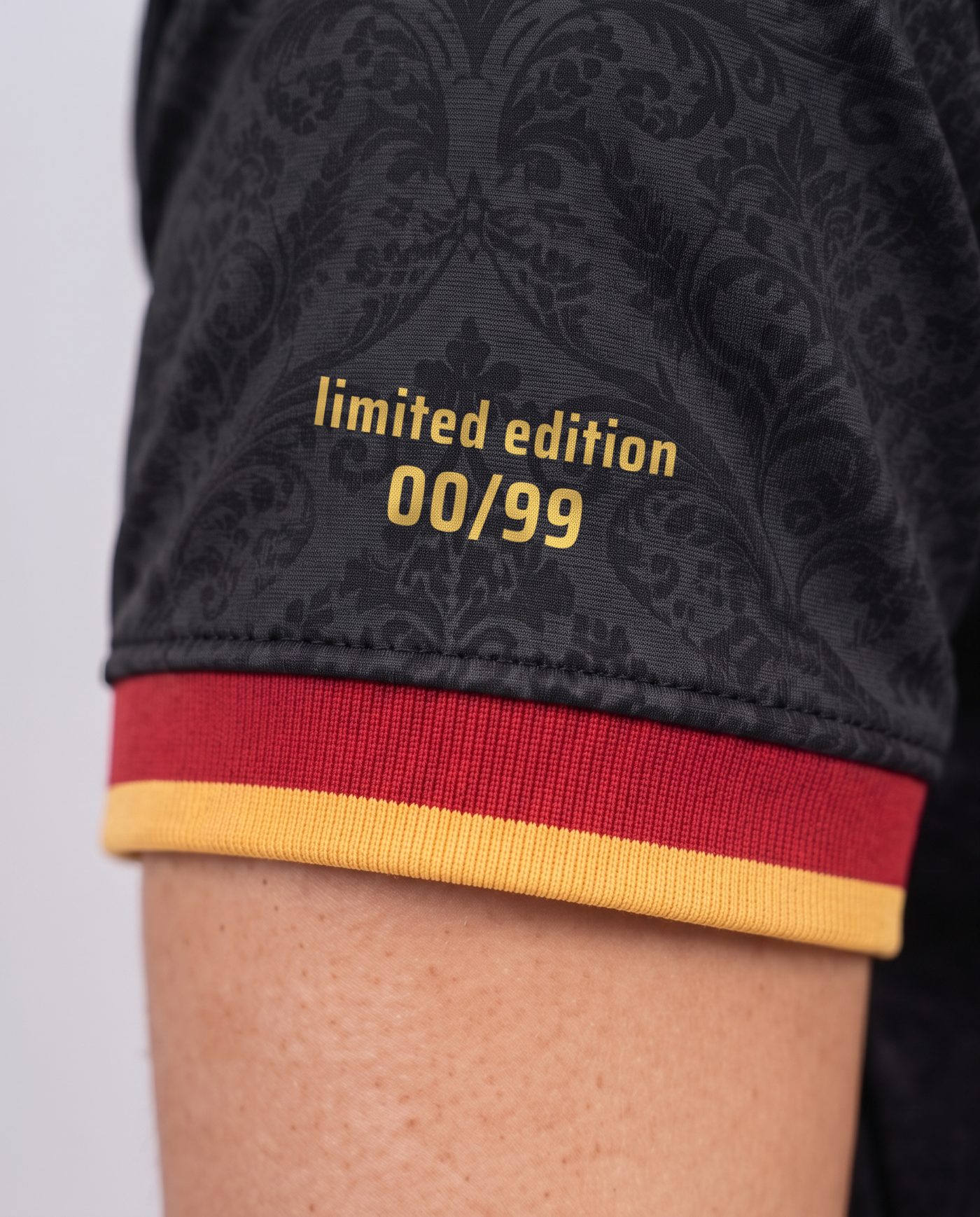 Close-up of the limited edition numbering on the sleeve of the Campeones 26 shirt