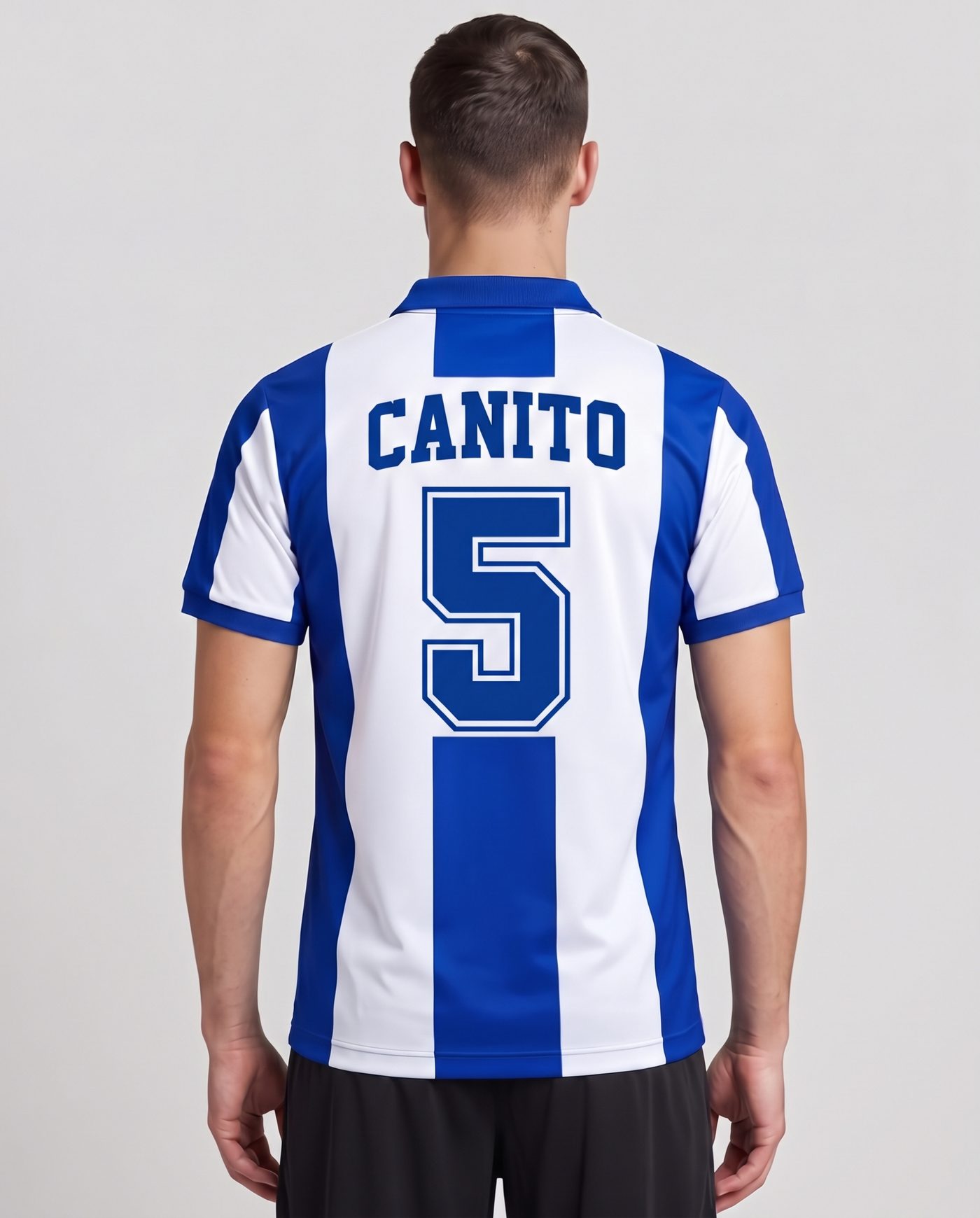 Back view wearing the blue and white Espanyol shirt, with the name Canito and the number 5