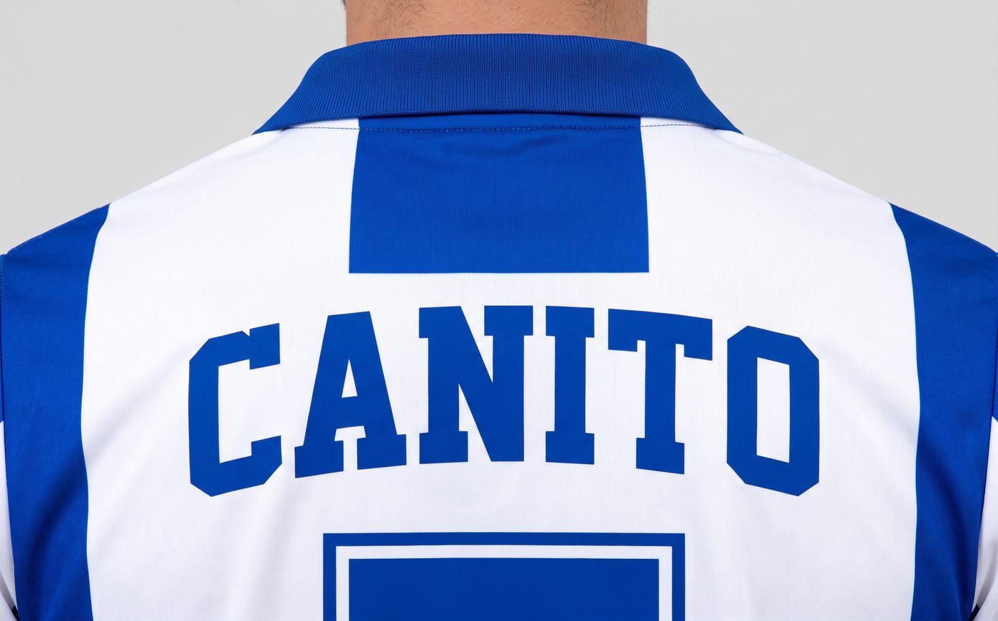 Close-up of the name Canito on the back of the blue and white Espanyol shirt