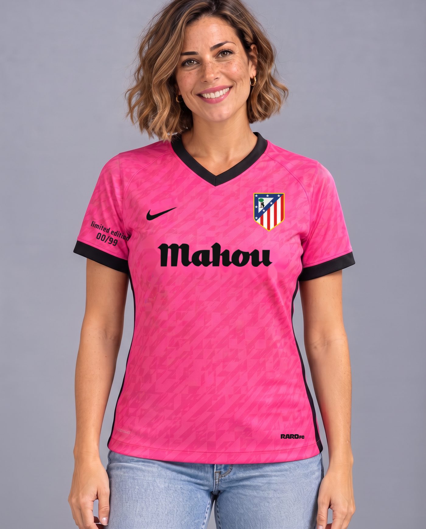 Front view wearing the women's pink and black Atlético F. Torres 9 shirt