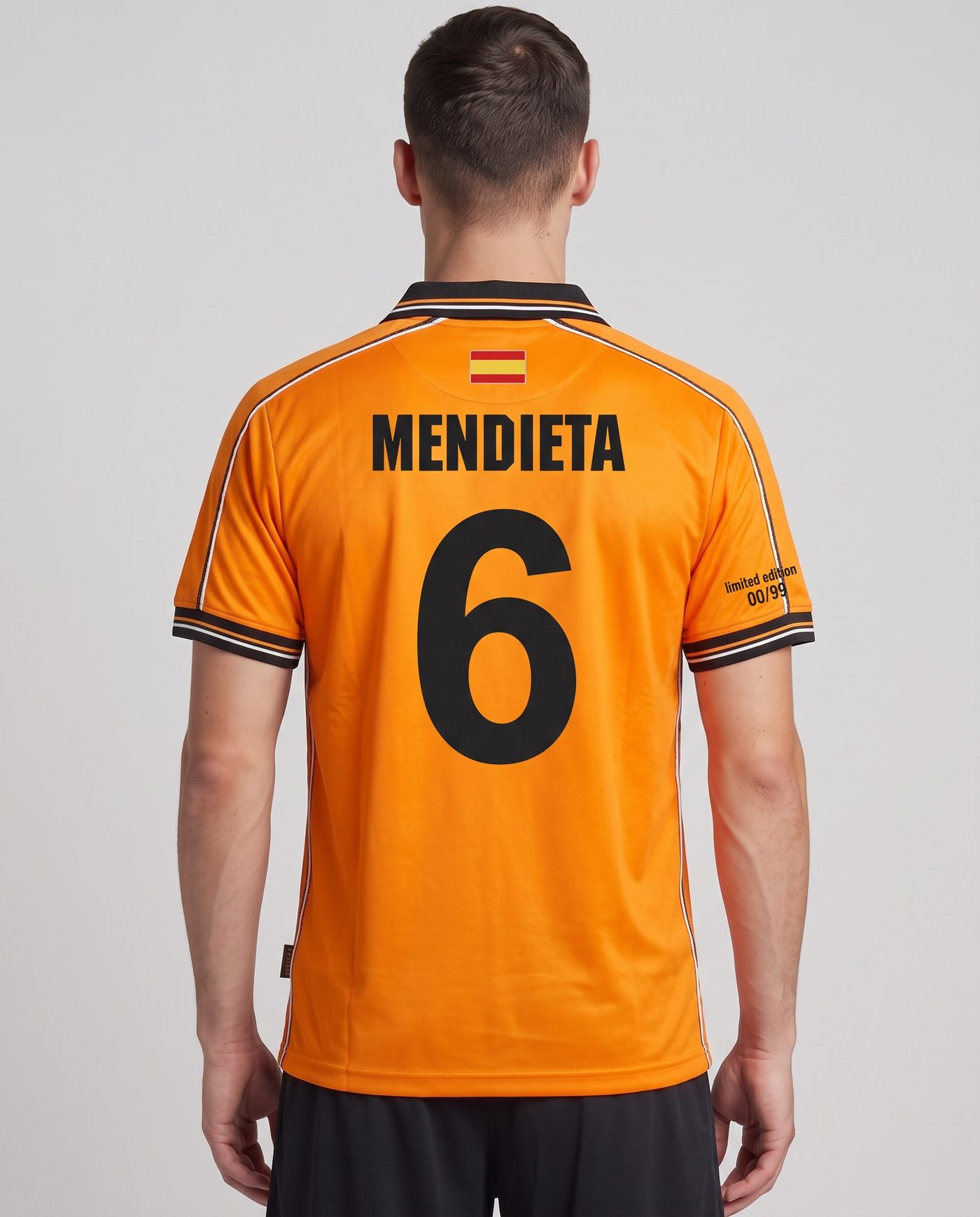 Back view wearing the orange Valencia shirt, with the name Mendieta and the number 6